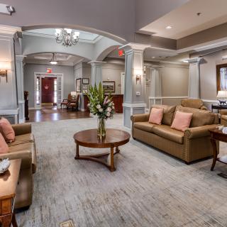 A spacious and elegantly designed lobby with comfortable seating and sophisticated decor.
