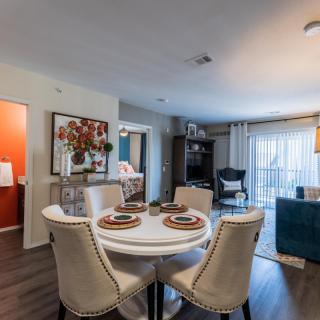 Stylish and cozy open-concept dining and living area with modern furnishings.
