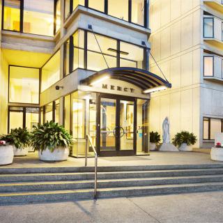 Modern building entrance illuminated at night.