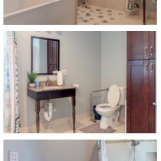 A modern, accessible bathroom featuring a walk-in shower with grab bars, a toilet with handrails, and a stylish sink.