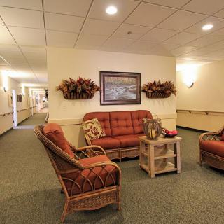 A cozy lobby area with comfortable seating and warm decor.
