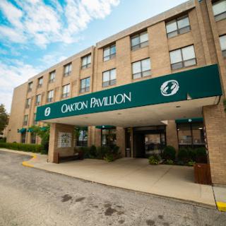 The entrance of the Orton Pavilion hotel, showcasing modern architecture and inviting ambiance.
