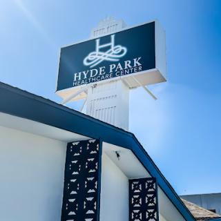 A clear view of the Hyde Park signage against a bright blue sky.