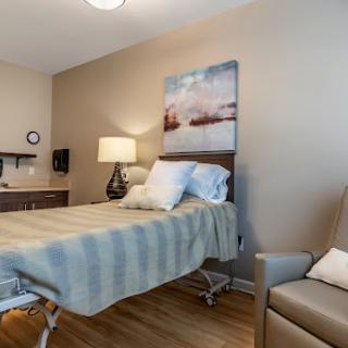 A well-lit and modern hospital room designed for comfort and care.