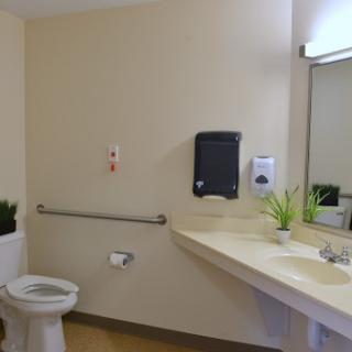 A clean and accessible bathroom with essential amenities.