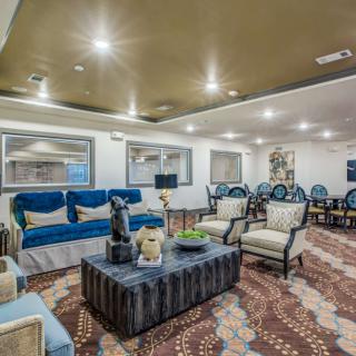 A spacious and elegantly designed living room with comfortable seating and modern decor.