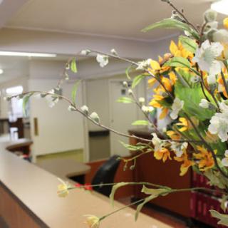 A beautifully arranged floral display greets visitors at the reception area.
