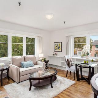 A bright and modern living room with stylish furniture and ample natural light.