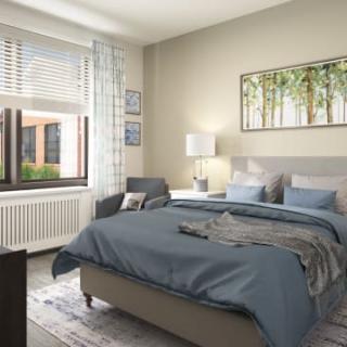 A modern bedroom interior with a cozy bed, soft lighting, and a large window.