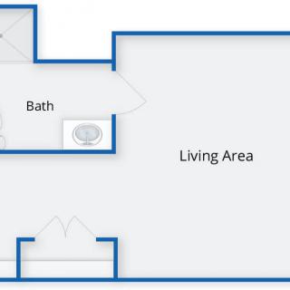 A basic floor plan showing a living area and a bathroom.