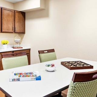 A kitchen table set up for games and puzzles.