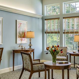 A cozy living room with elegant furniture and natural lighting.