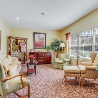A cozy living room with comfortable seating and warm lighting.