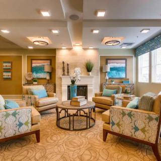 A cozy and elegantly decorated living room with comfortable seating and stylish decor.