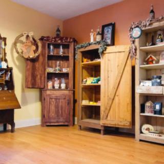 A cozy room with rustic wooden furniture and decorative items.