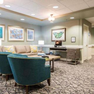 A cozy waiting room with comfortable seating and elegant decor.