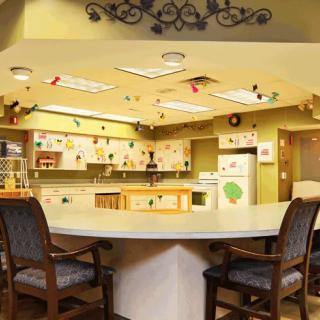 A cozy kitchen and dining area with colorful decorations and ample seating.