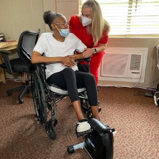 A moment of support and encouragement in a rehabilitation setting.