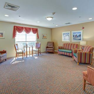 A cozy living room featuring comfortable seating and natural light.