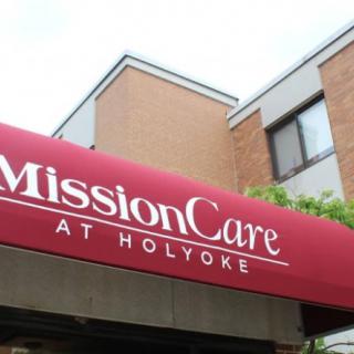 Entrance of MissionCare at Holyoke with a red awning.