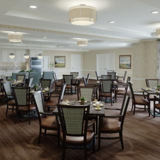 A modern dining room with neatly arranged tables and chairs, complemented by soft lighting and tasteful decor.