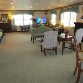 A cozy living room with sofas and a television.