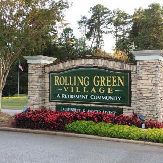 Entrance sign for Rolling Green Village, a retirement community.