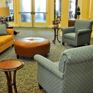 A cozy living room with comfortable seating and elegant decor.