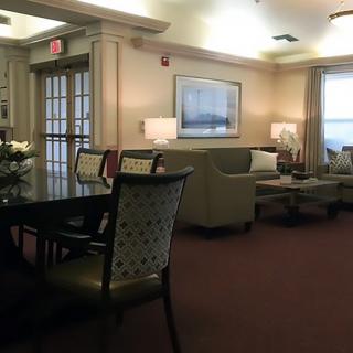 A cozy living room with comfortable seating and ambient lighting.