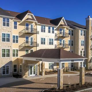 A modern residential apartment building with a welcoming entrance.