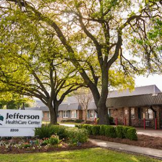Jefferson Healthcare Center, surrounded by lush greenery.