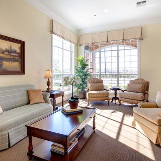 A bright and cozy living room with comfortable seating and natural light.