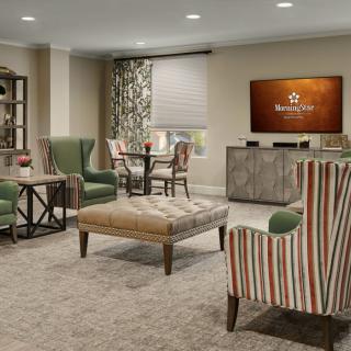 A cozy living room with comfortable seating and a television.