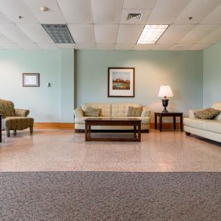 A spacious lobby area with comfortable seating and elegant decor.