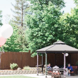 A sunny day in the garden, perfect for a relaxing gathering under the gazebo.