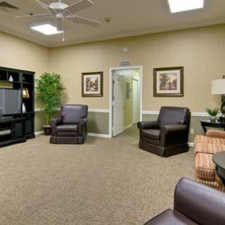 A cozy living room with comfortable seating and a television.