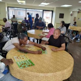 Residents enjoy a lively game of bingo at the senior center, fostering community and connection.