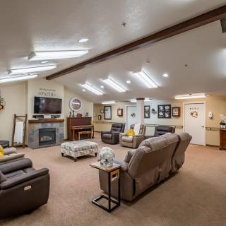 Spacious living room with comfortable seating and a cozy fireplace.