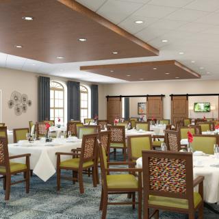 A spacious and elegantly designed dining room with neatly arranged tables and chairs.
