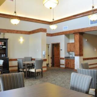 A spacious and well-lit living and dining area with comfortable seating and elegant decor.