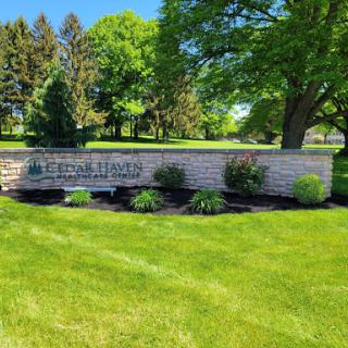 A welcoming entrance sign surrounded by lush greenery.