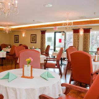 An elegant dining space featuring comfortable seating and tasteful decor.