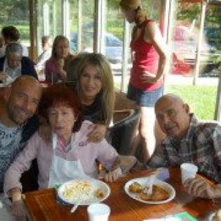 A group of people enjoying a meal together at a restaurant.