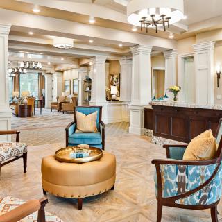 A luxurious lobby with elegant furniture and a spacious seating area.