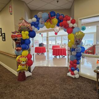 A vibrant balloon archway welcoming guests to an event.