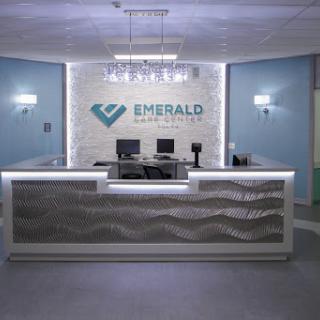 A modern reception area featuring sleek design and branding.