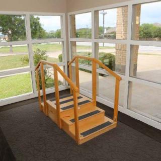 Indoor rehabilitation stairs used for physical therapy exercises.