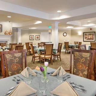 An elegant dining room with neatly set tables and stylish decor.