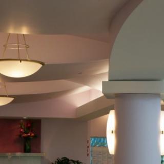 A modern interior featuring soft lighting and architectural columns.