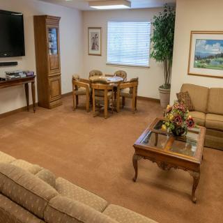 A cozy living room with comfortable seating and tasteful decorations.